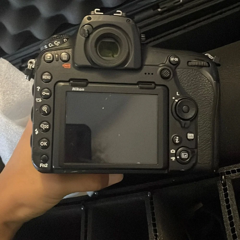 Nikon D850 digital black camera. With battery charger